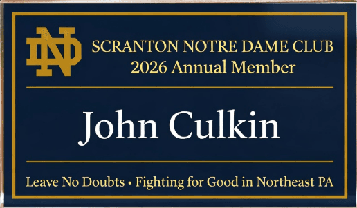 Personalized membership placard: navy with gold border, ND monogram, Scranton Notre Dame Club 2026 Annual Member, your name, and the Leave No Doubts motto
